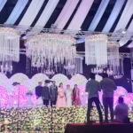 Spacious wedding hall at Sri Palani Convention Center, Peerzadiguda, Hyderabad – featuring elegant floral decorations, ambient lighting, and ample seating arrangements for a grand celebration