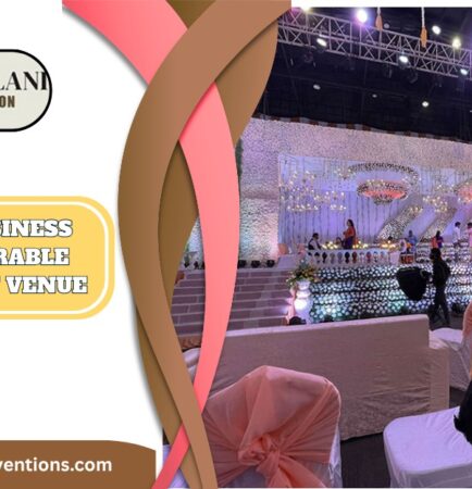 Guests attending a business launch at a modern convention hall in Uppal, Hyderabad with branding and stage decor